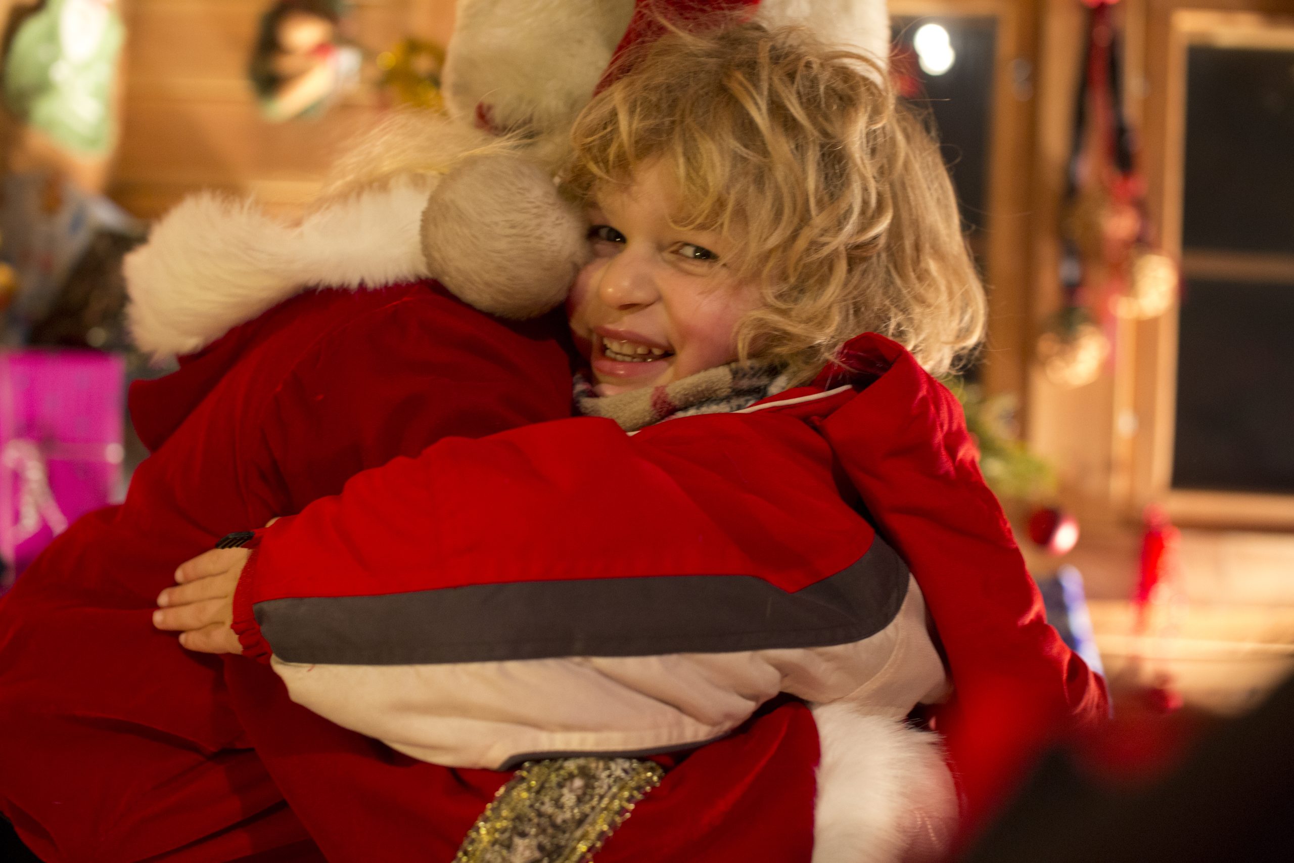 Kid higging Santa