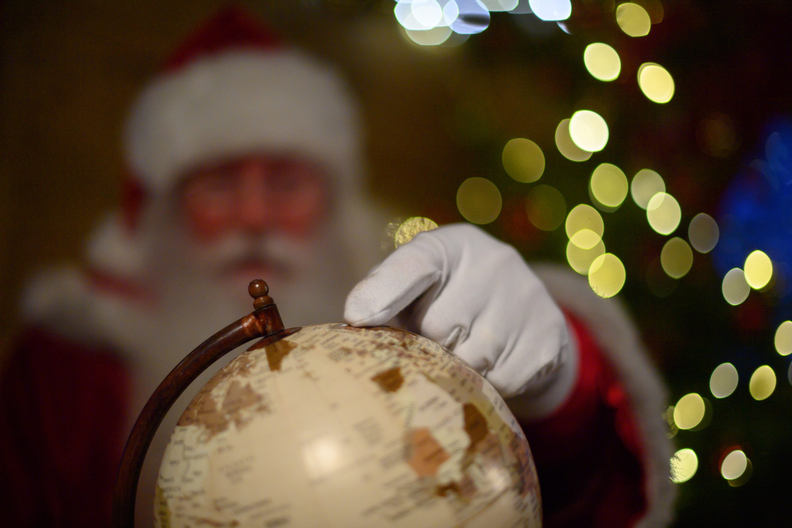 Santa pointing at Globe