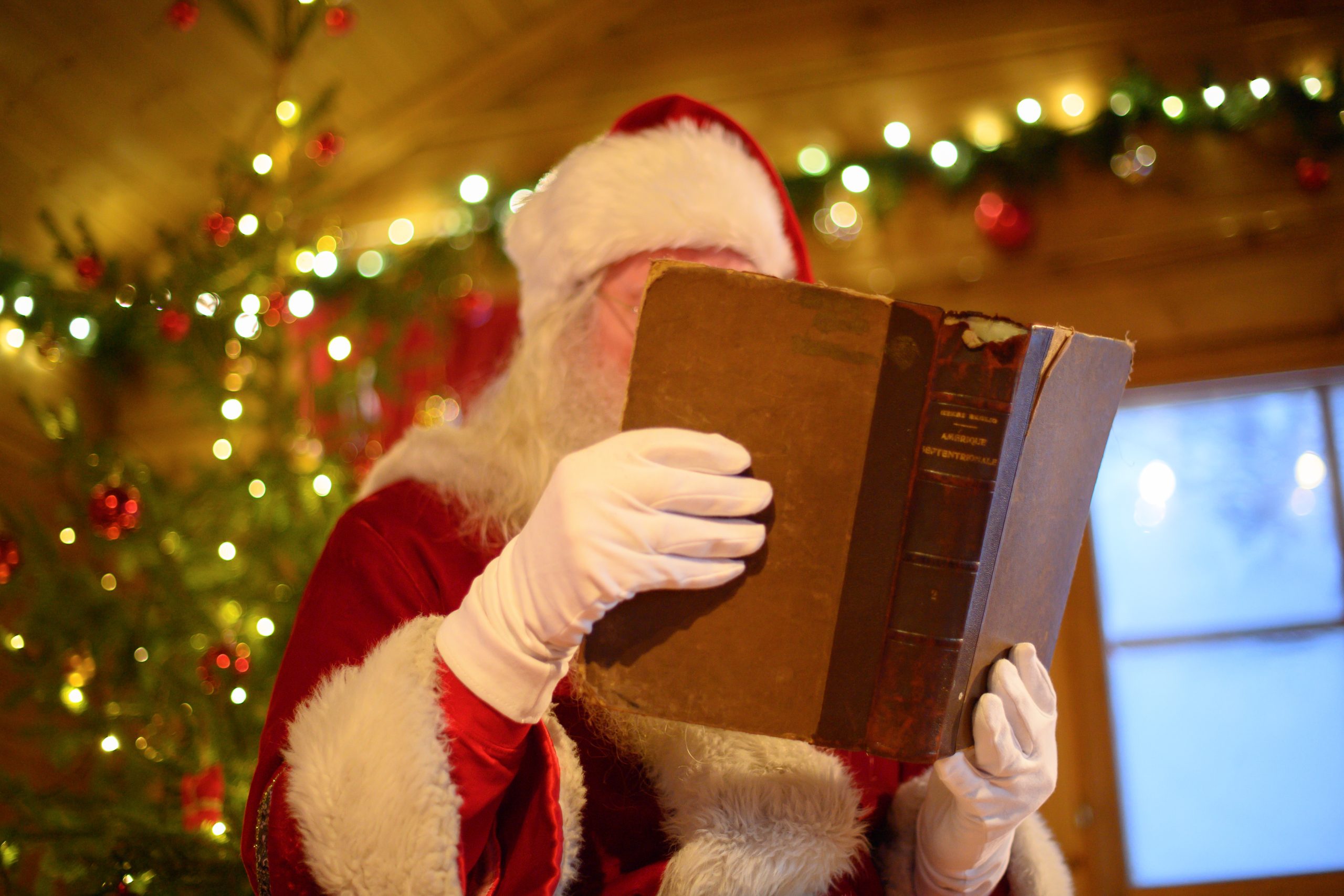 Santa reading his book