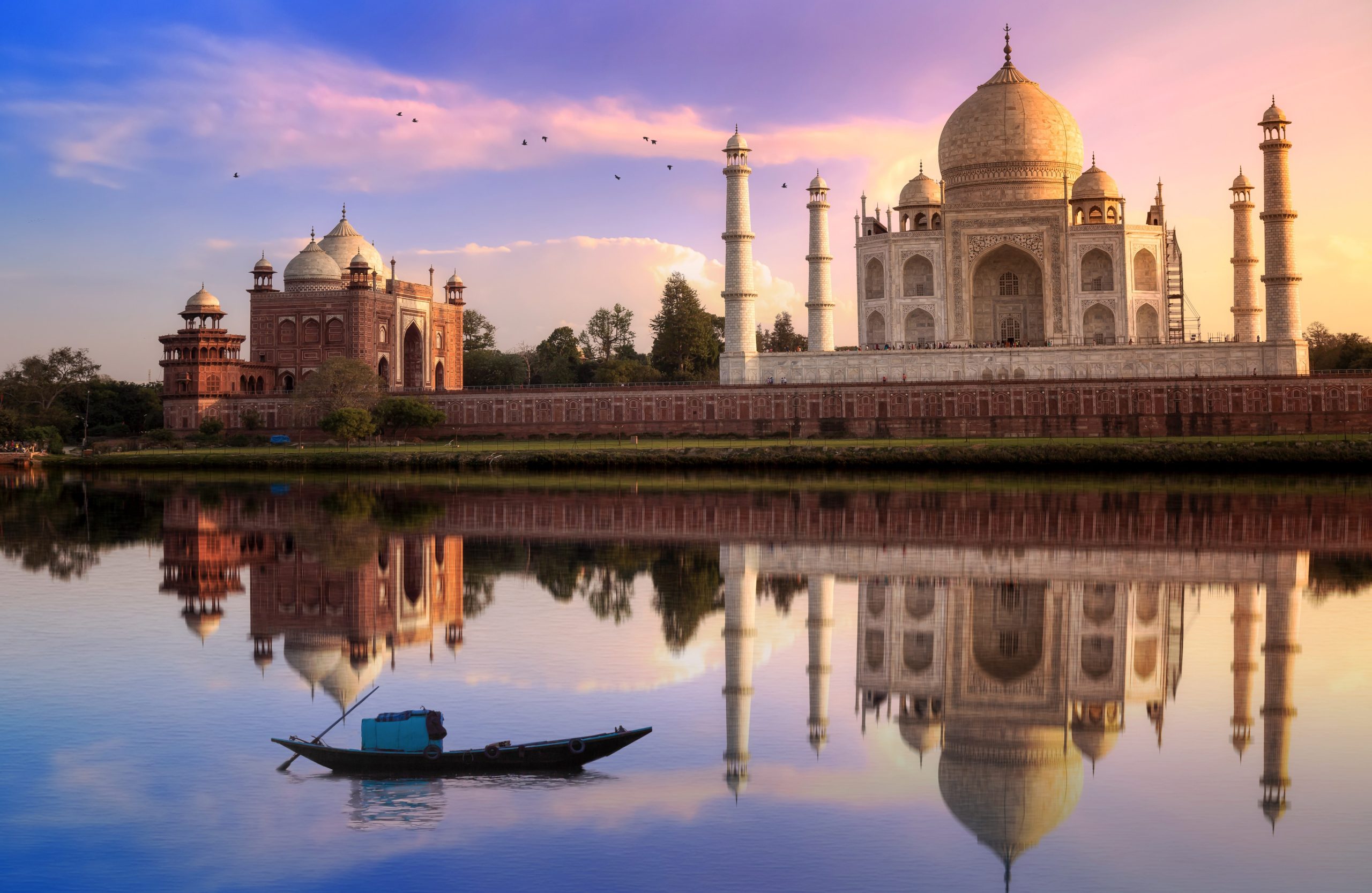 GettyImages-1045842578 Taj Mahal Agra India at sunset with mirror reflection and vibrant sky. Taj Mahal is located at the banks of river Yamuna.